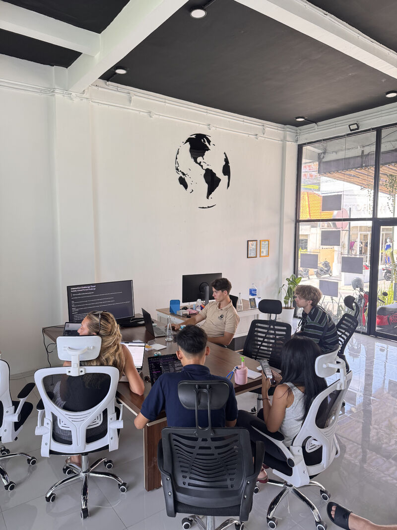 Pellago team working through hands-on AI tasks on their laptops during the luup workshop